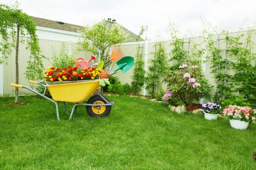 Finished sustainable garden area showing mulched lawn and reused planters